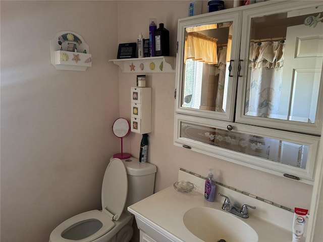 bathroom with vanity and toilet