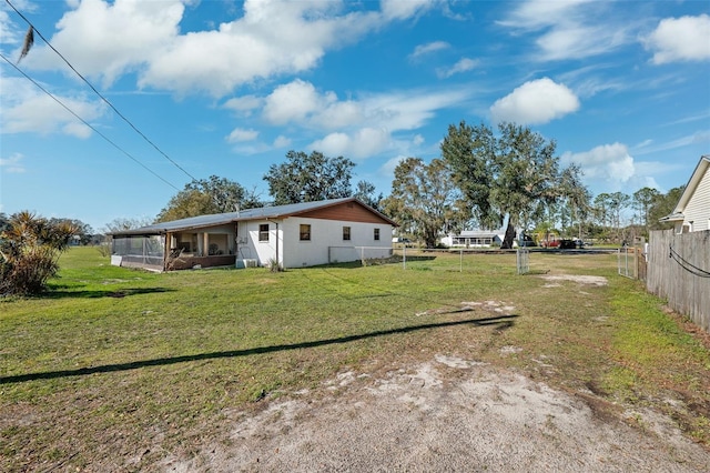 view of yard featuring a sunroom