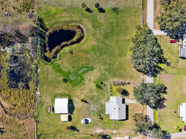 birds eye view of property with a rural view and a water view