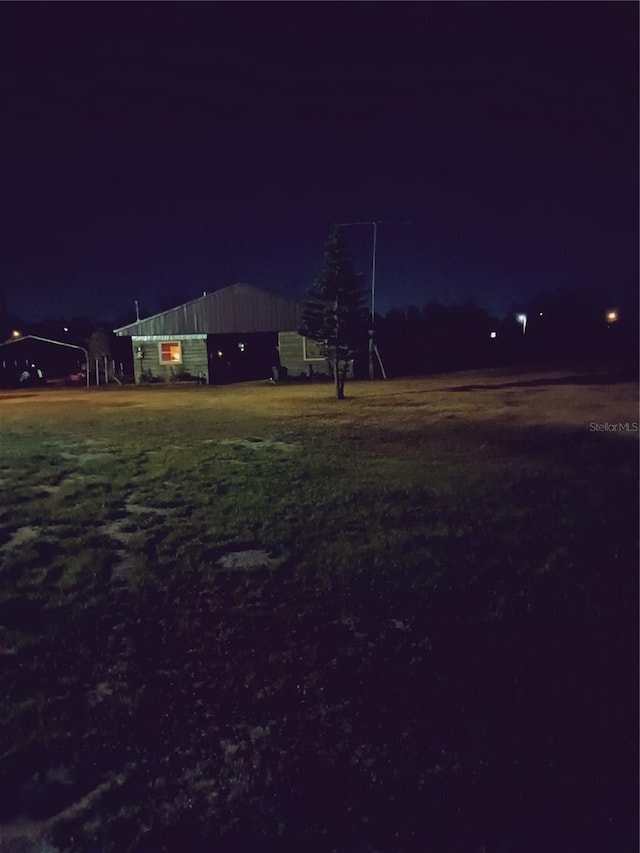 view of yard at twilight