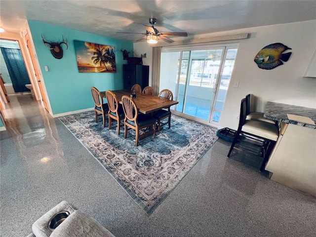 dining room featuring a textured ceiling and ceiling fan