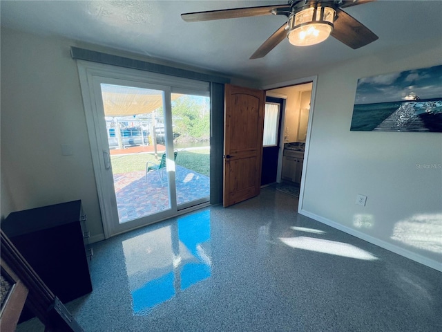 spare room with ceiling fan