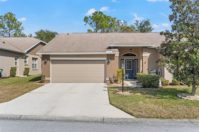 ranch-style home featuring a garage and a front lawn