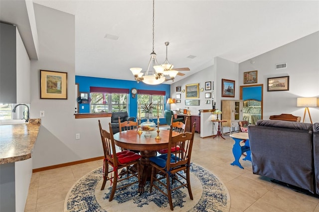 tiled dining area featuring lofted ceiling, sink, and a notable chandelier