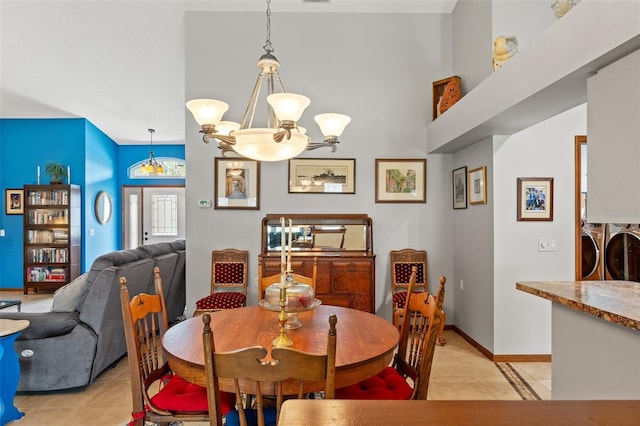 tiled dining space featuring a chandelier