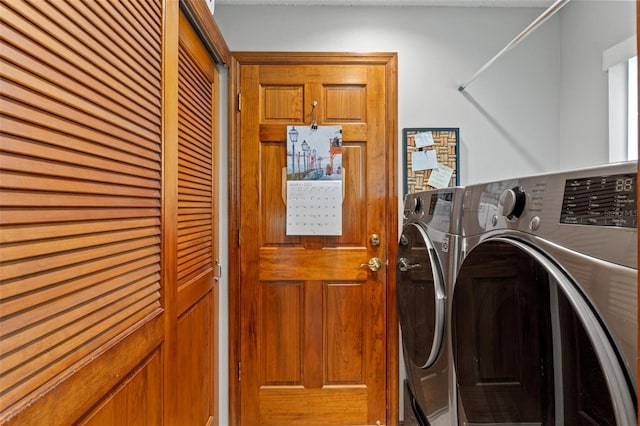 clothes washing area featuring separate washer and dryer