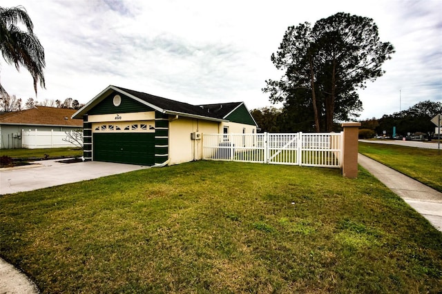 single story home featuring a garage and a front lawn