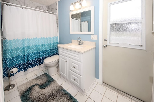 bathroom featuring tile patterned floors, vanity, toilet, and a shower with shower curtain