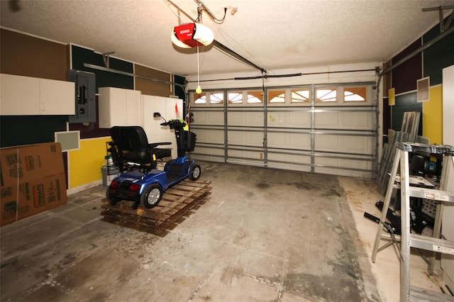 garage with a garage door opener and electric panel