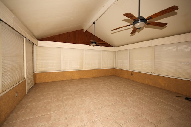 unfurnished sunroom featuring vaulted ceiling with beams and ceiling fan