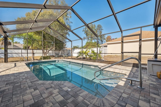 view of pool with a lanai and a patio