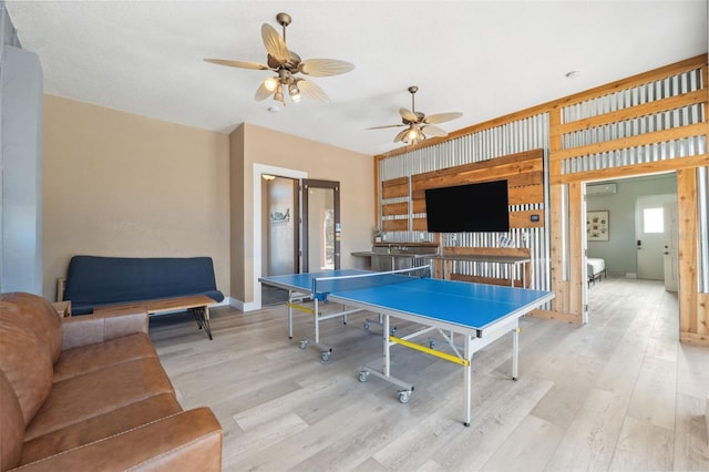 game room with ceiling fan and light hardwood / wood-style flooring