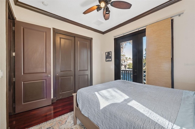 bedroom featuring ornamental molding, dark hardwood / wood-style flooring, a closet, ceiling fan, and access to exterior