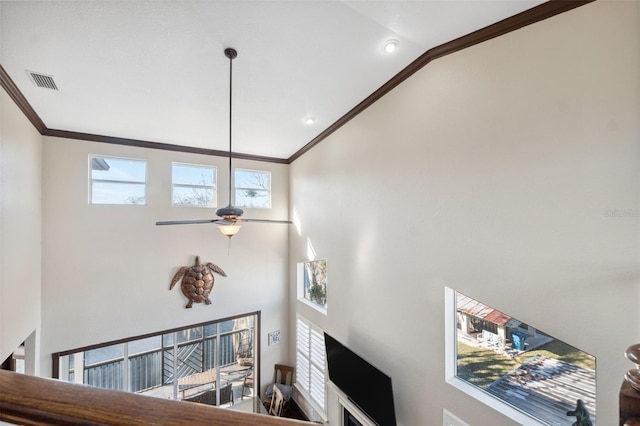 living room with crown molding, high vaulted ceiling, and ceiling fan