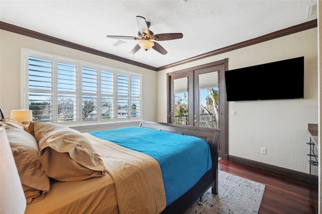 bedroom with ornamental molding, access to exterior, ceiling fan, dark wood-type flooring, and a textured ceiling