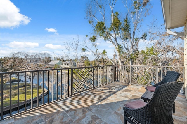 balcony featuring a water view