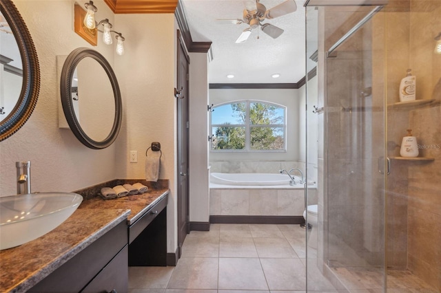 full bathroom featuring vanity, ornamental molding, a textured ceiling, tile patterned floors, and independent shower and bath