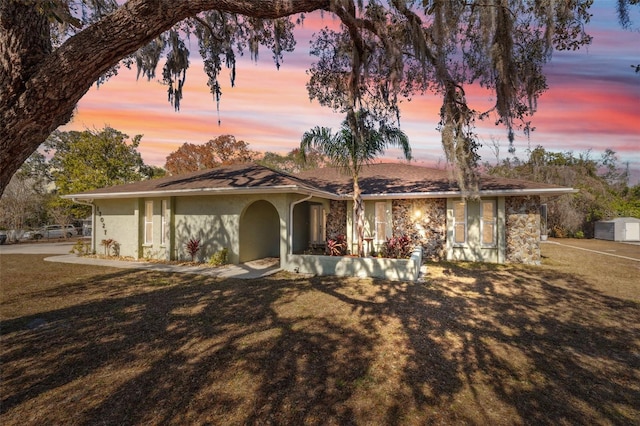 ranch-style house featuring a yard