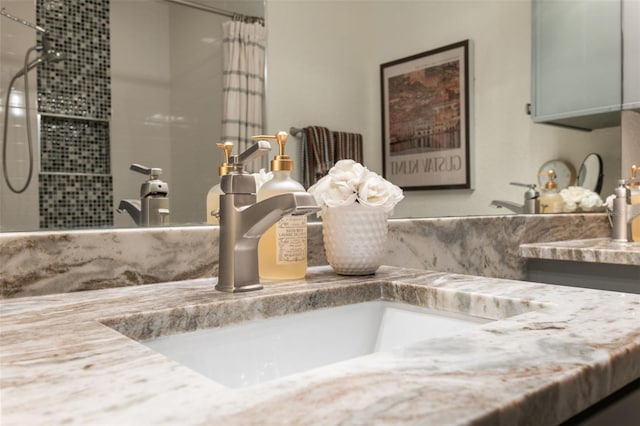 bathroom featuring vanity and a shower with curtain