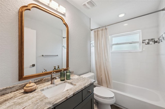 full bathroom with vanity, toilet, and shower / bath combo with shower curtain