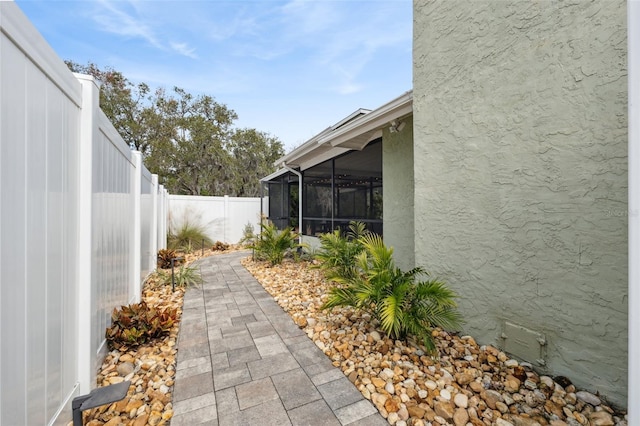 view of yard with a sunroom