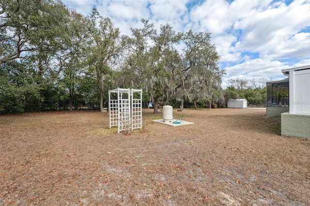 view of yard featuring a sunroom