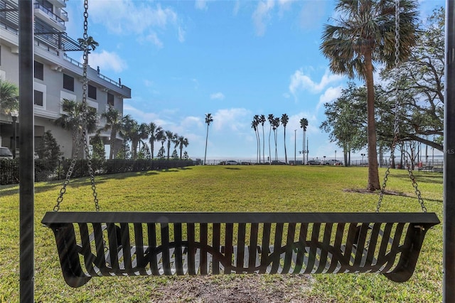 view of property's community featuring a lawn