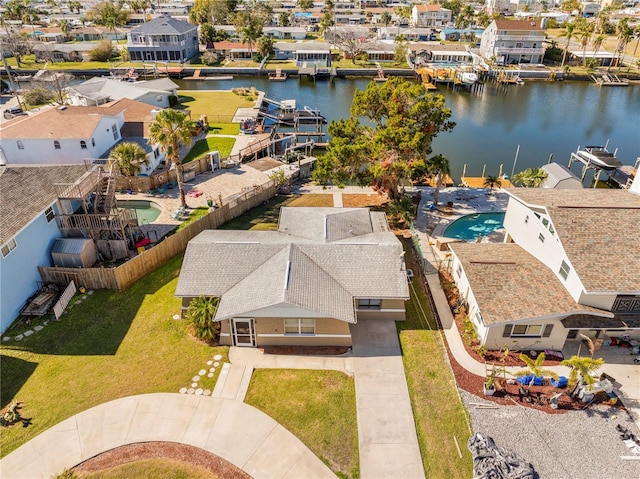 birds eye view of property featuring a water view