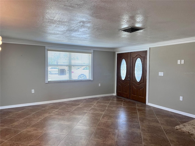 13637 Lagoon Dr, Hudson, FL 34667 - foyer with crown molding, baseboards, a textured ceiling, and visible vents