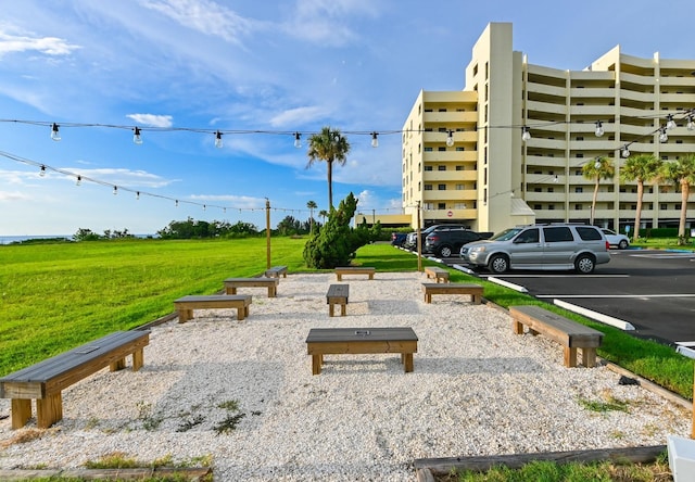 view of property's community featuring a yard