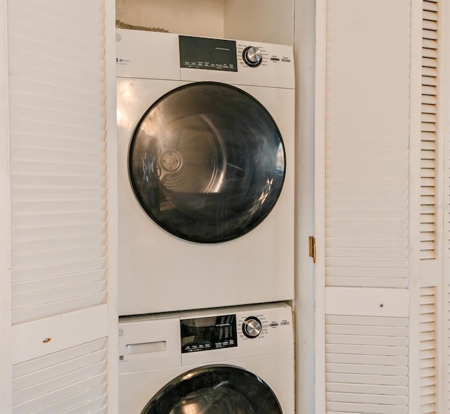 laundry area with stacked washer and dryer