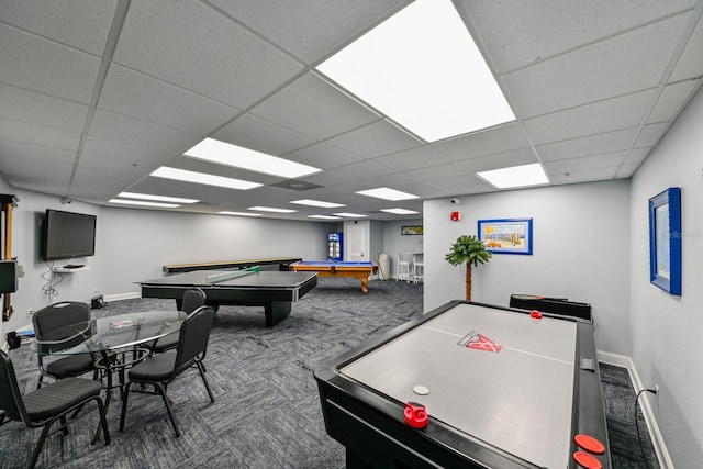 rec room with dark carpet, a paneled ceiling, and billiards