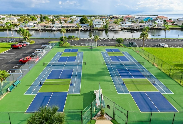 view of sport court featuring a water view