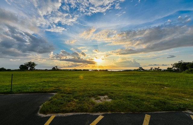 yard at dusk with a rural view