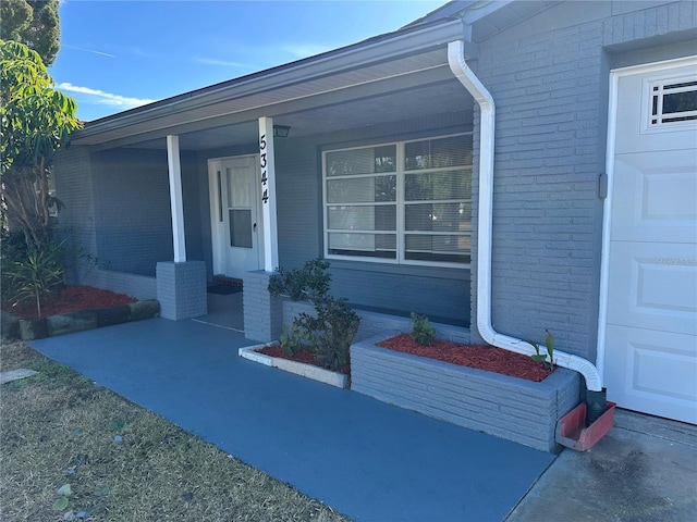 doorway to property featuring a porch