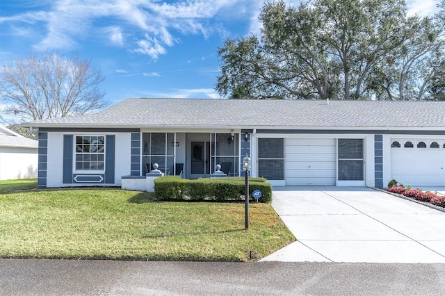 ranch-style house with a garage and a front yard