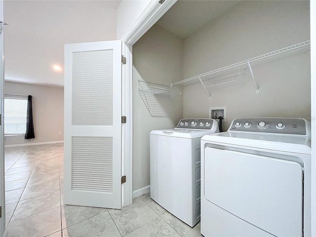 laundry room featuring washing machine and clothes dryer