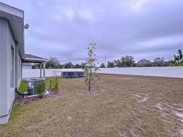 view of yard with central AC unit