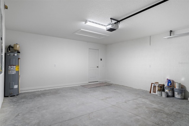 garage featuring a garage door opener and electric water heater