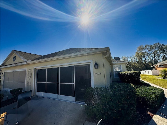 view of property exterior featuring a garage