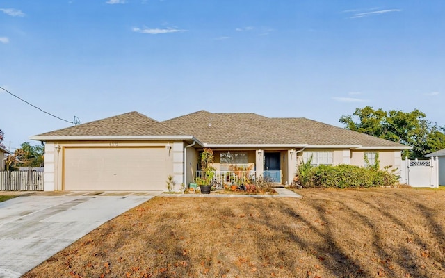 ranch-style house with a garage and a front yard