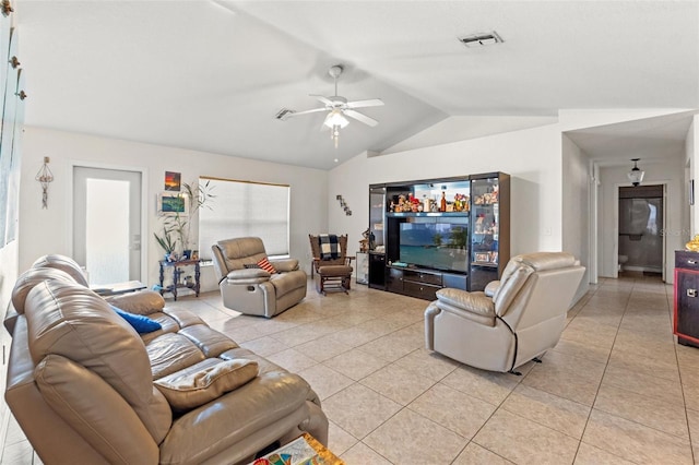 tiled living room with ceiling fan and lofted ceiling