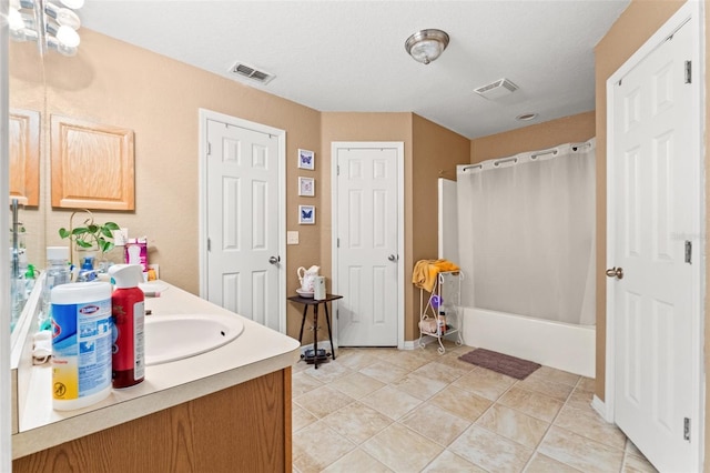 bathroom featuring vanity, shower / tub combo, and tile patterned flooring