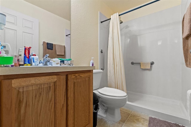 bathroom featuring vanity, toilet, tile patterned flooring, and a shower with shower curtain