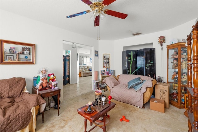 living room featuring ceiling fan and light carpet