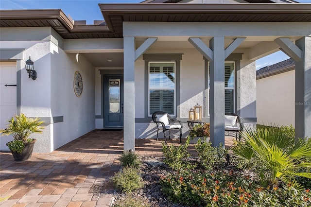 doorway to property featuring covered porch