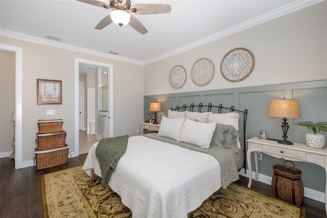 bedroom with dark hardwood / wood-style floors, ceiling fan, ornamental molding, and connected bathroom