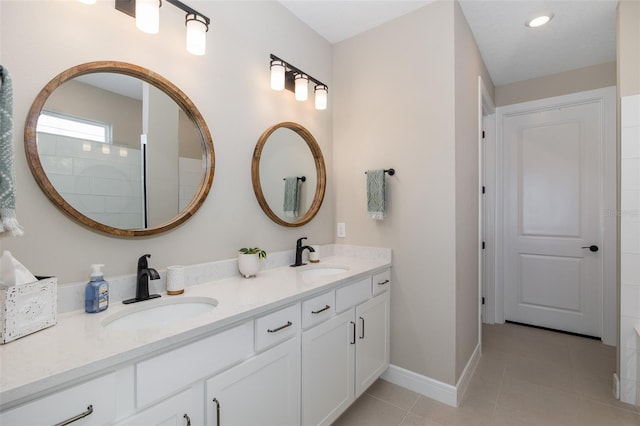 bathroom with vanity and tile patterned flooring