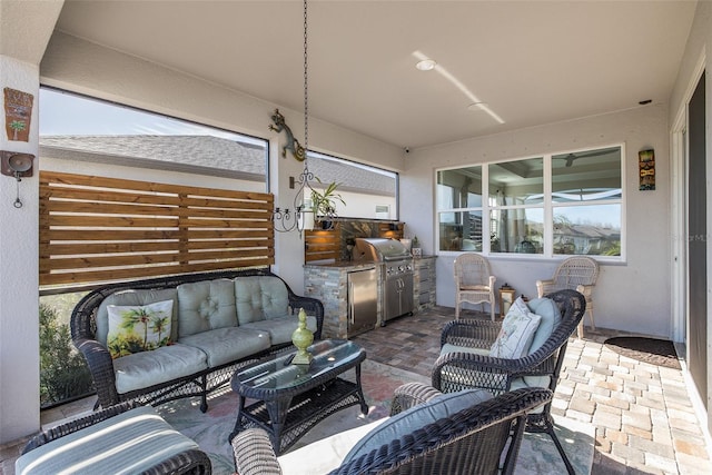 view of patio with an outdoor living space, a grill, and area for grilling