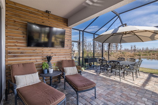 view of patio with glass enclosure